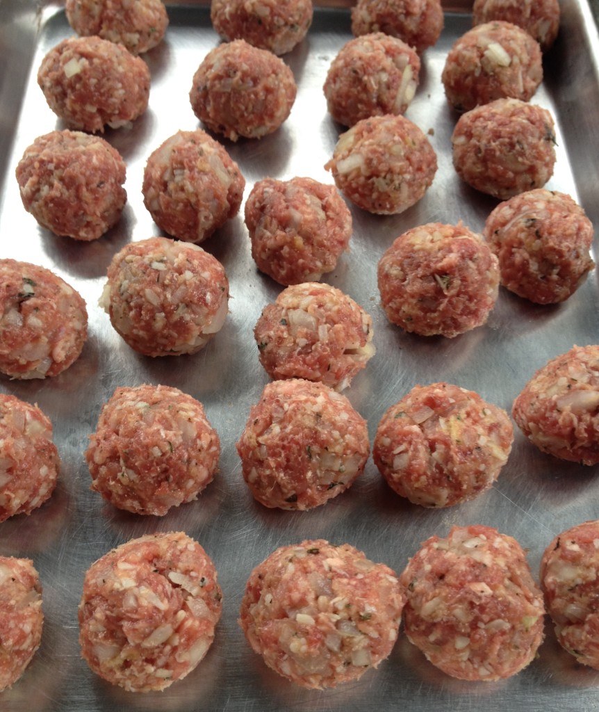 Raw meatballs all rolled out, waiting to be seared